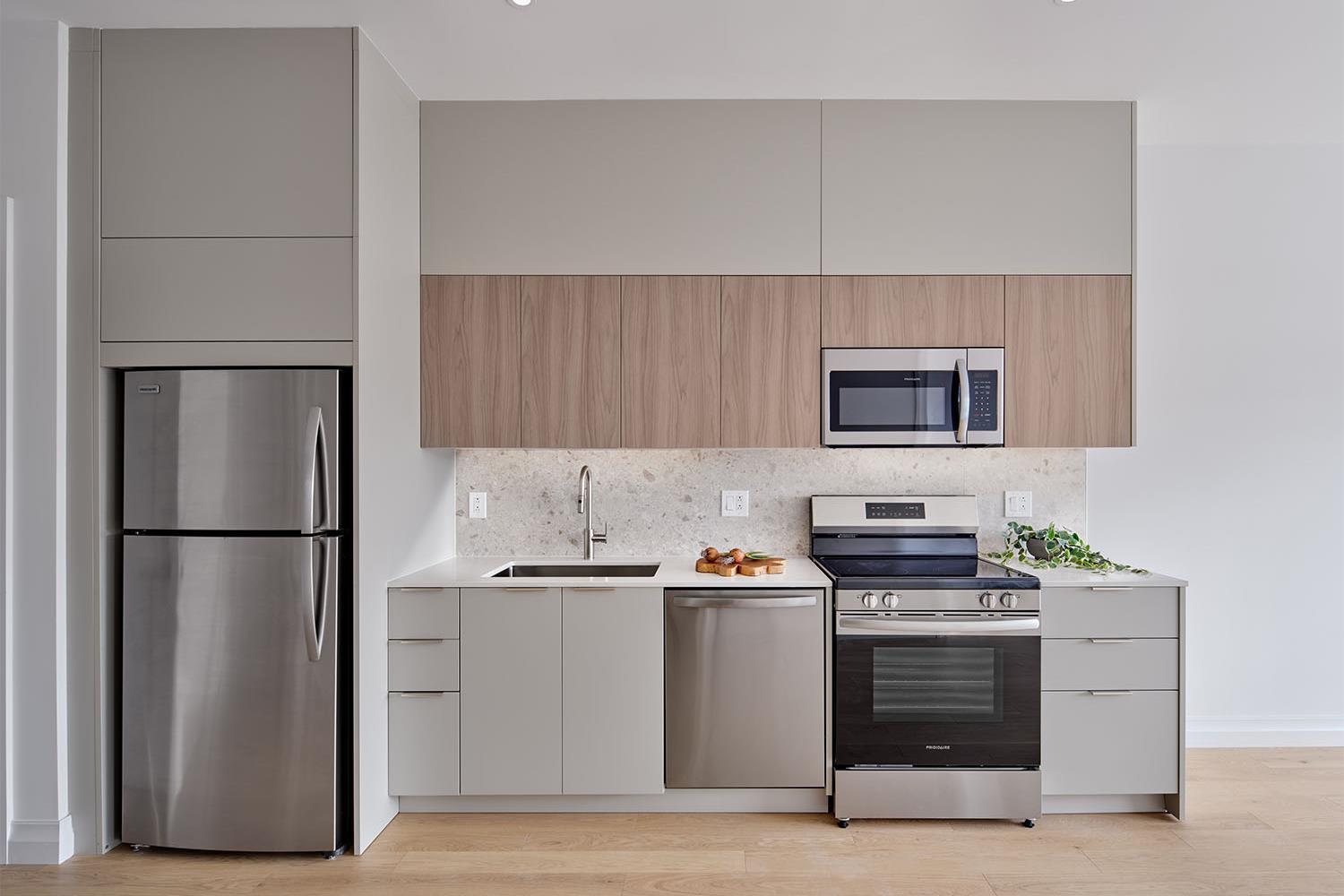 Kitchen with stainless steel appliances and stone details