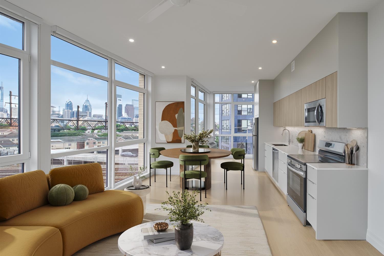 Living area, kitchen, and round dining room table with wall to floor windows
