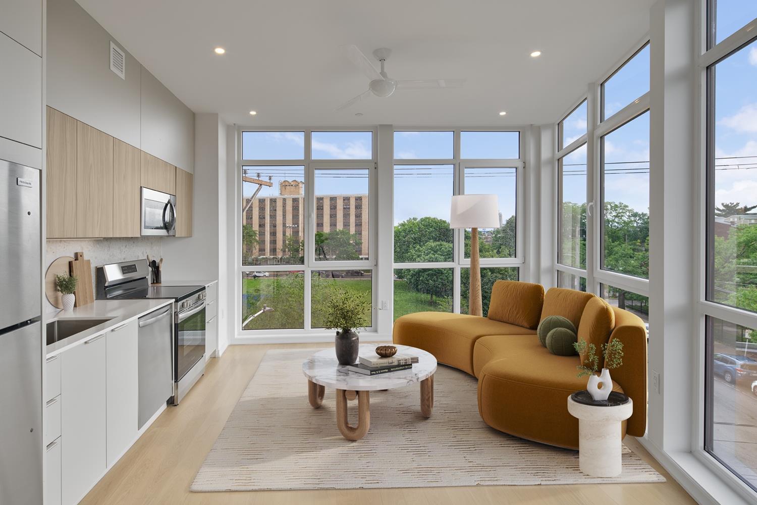 Cozy couch facing the kitchen with a marble coffee table