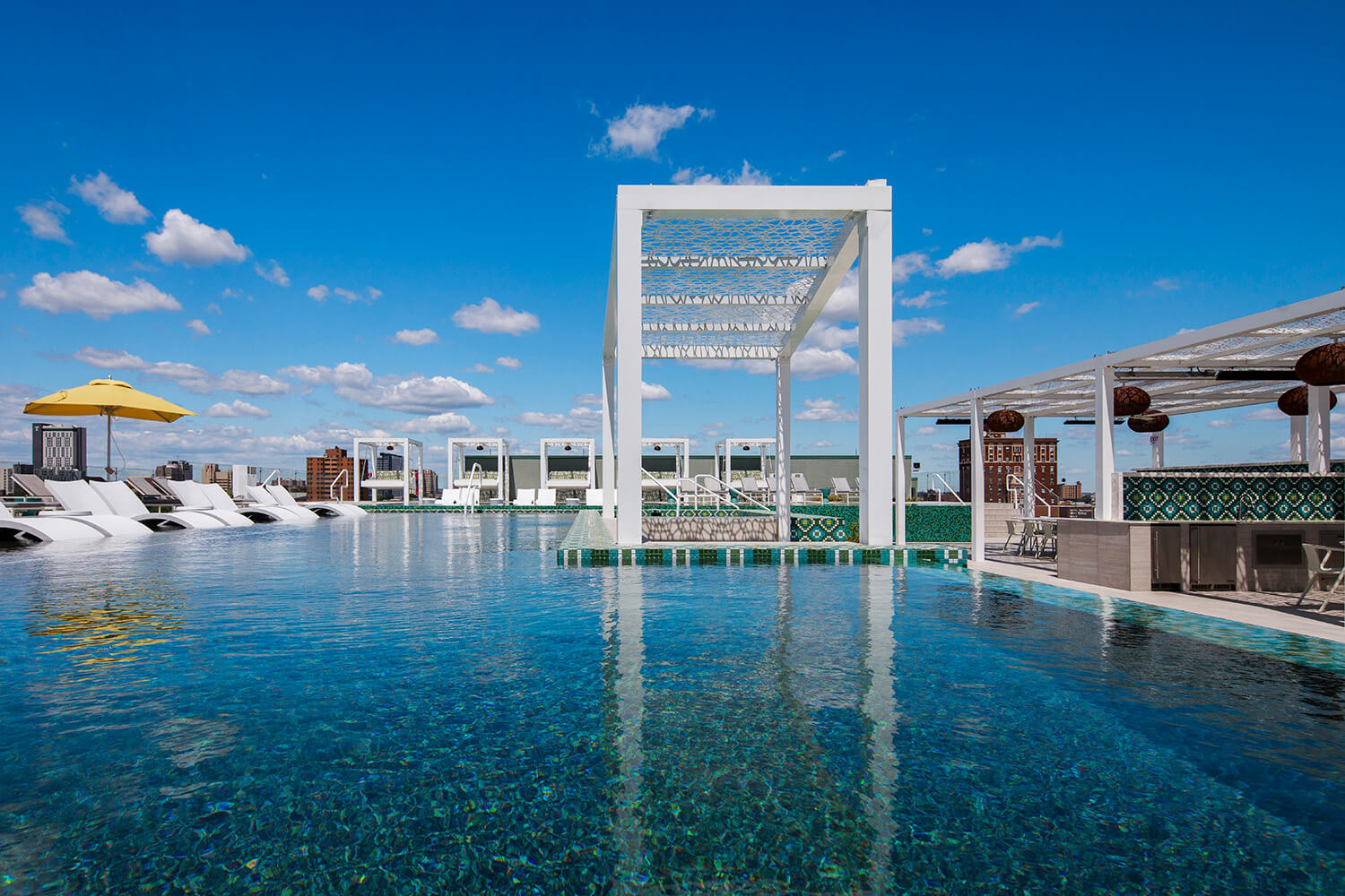 Infinity pool with private cabanas